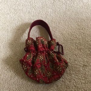 Maroon embroidered drawstring small purse